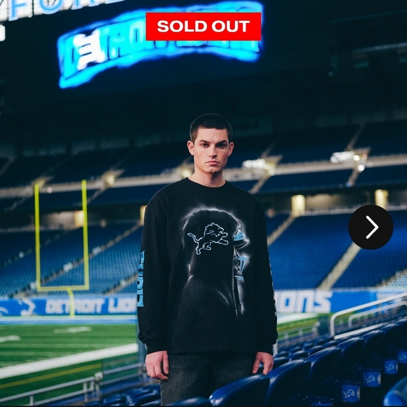 NFL Tops - Black Long Sleeve Shirt with Blue Lion Graphic